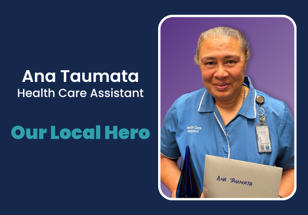 A person in a blue uniform holding a blue trophy
