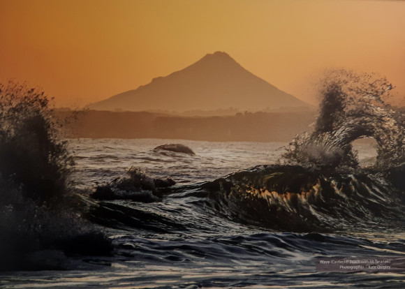 Kate Quigley's stunning shot of waves crashing on to Castlecliff beach with Mt Taranaki in the background.